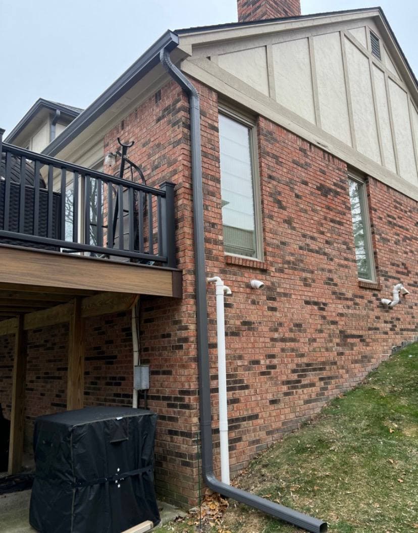 Seamless gutter and downspout installation on brick home — Allen Park MI